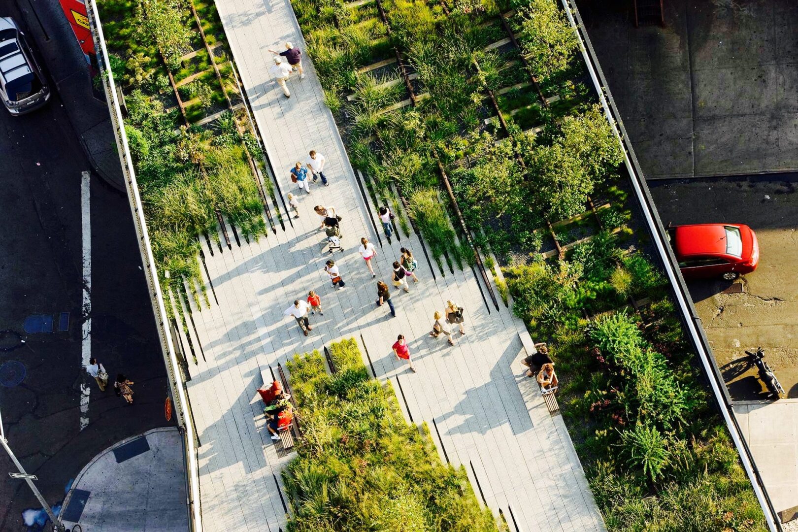 A group of people walking on top of a walkway.