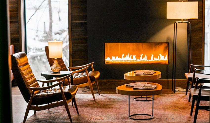 A fireplace in the middle of a living room.