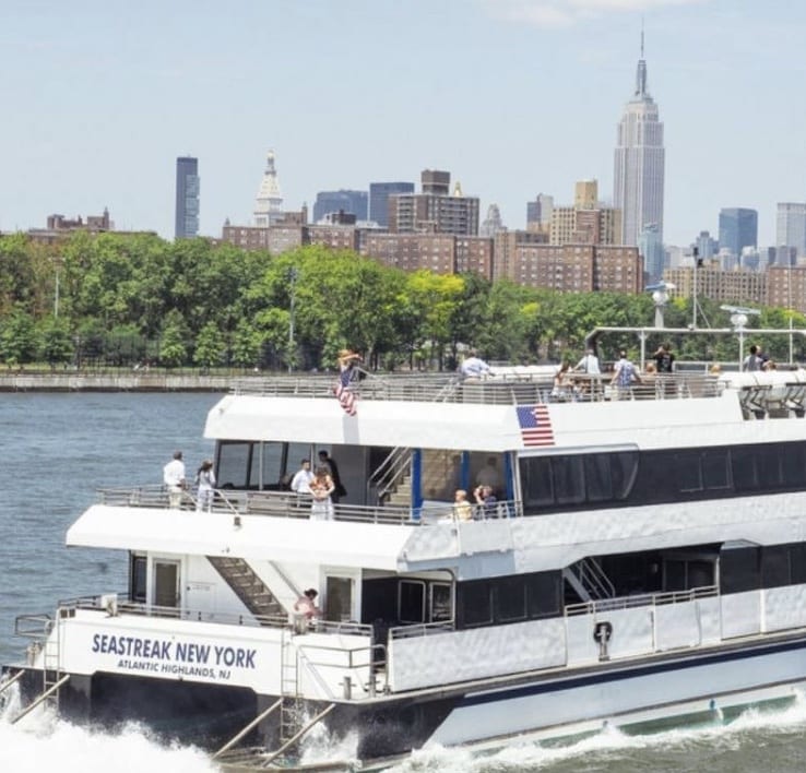 A large white boat with people on it.