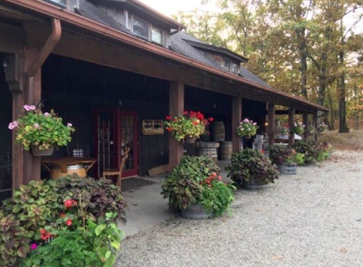 A building with many flowers in front of it