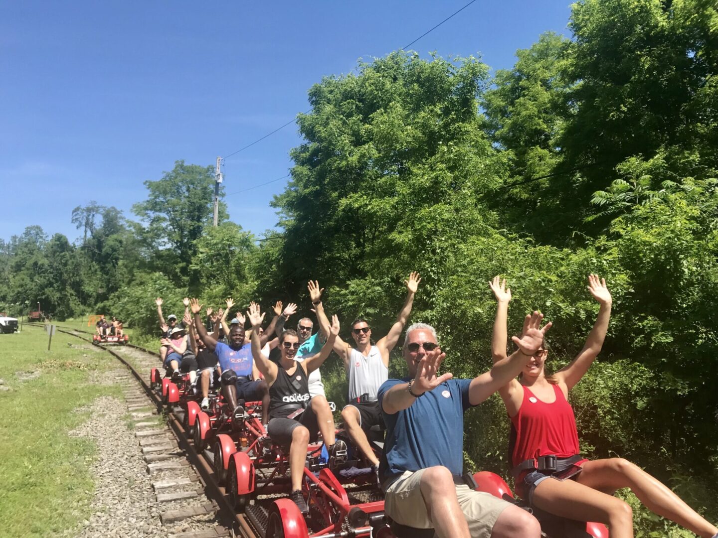 A group of people riding on the back of a train.