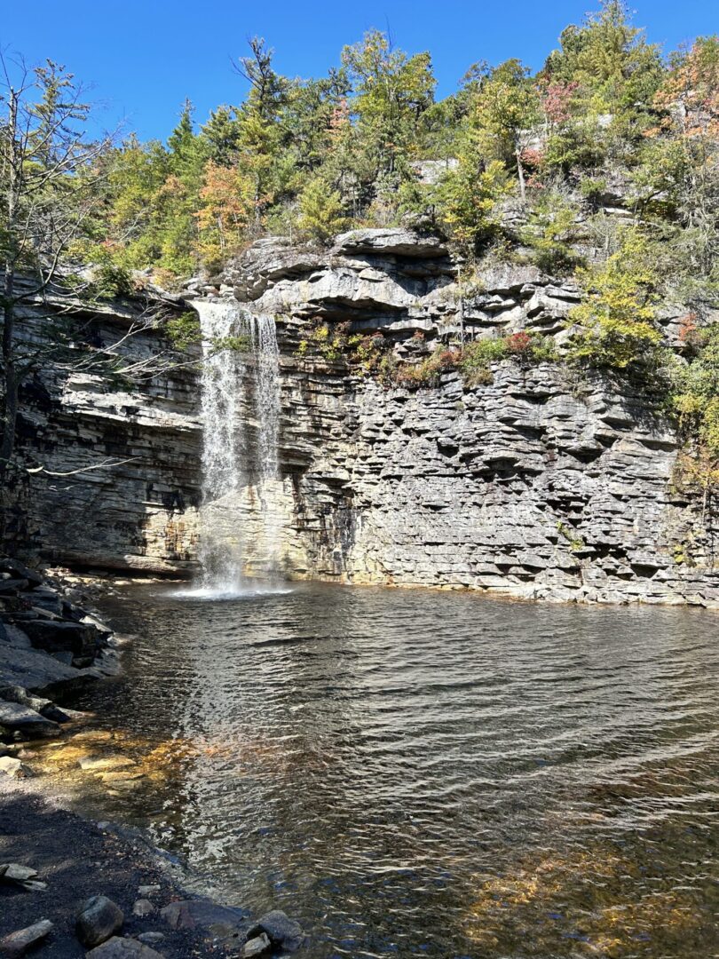 A waterfall is shown near the water.