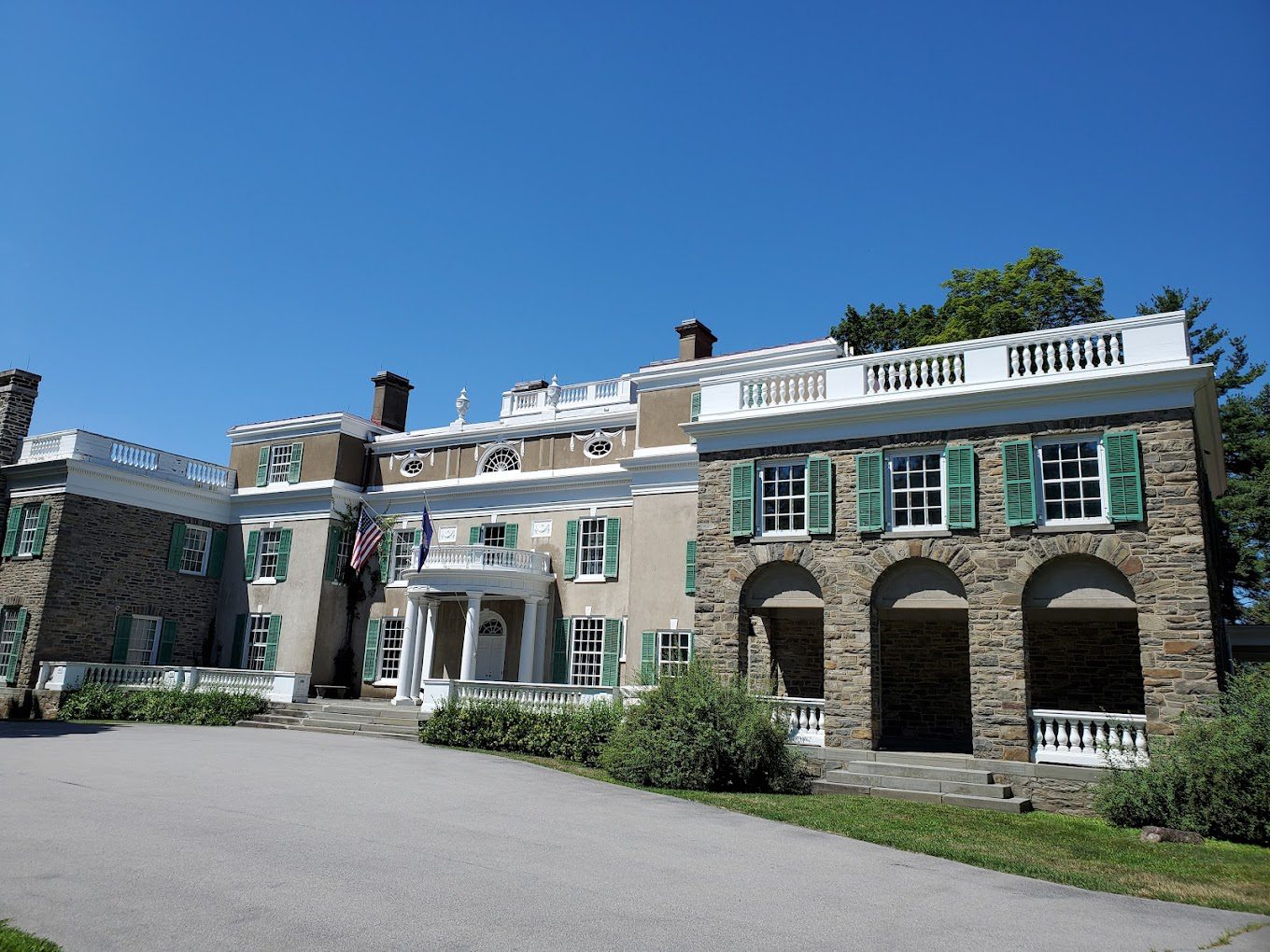 A large building with many windows and shutters.